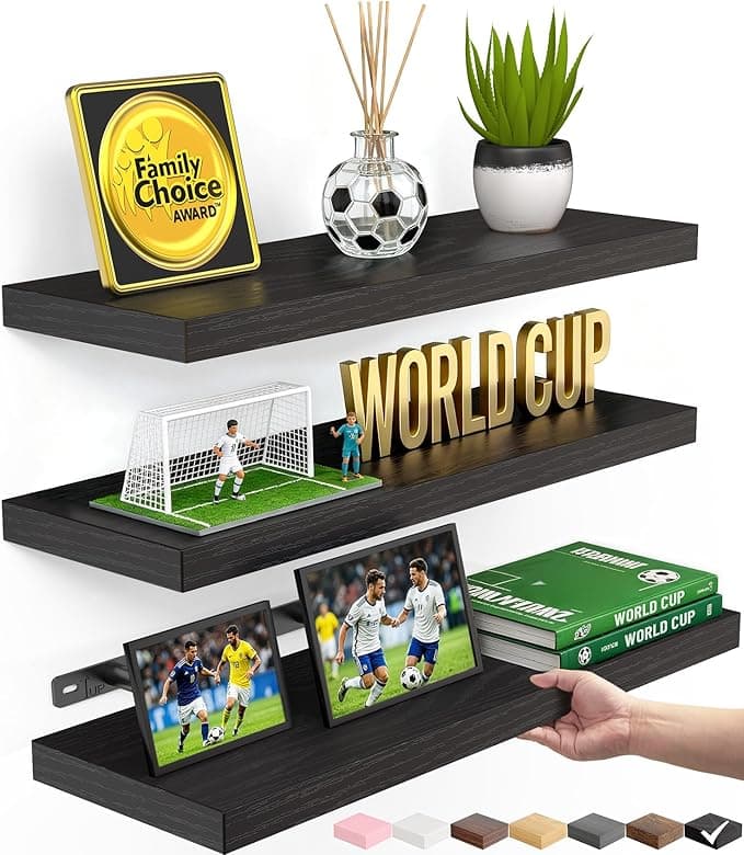 Set of three solid wood floating wall shelves in staggered lengths displaying books and plants